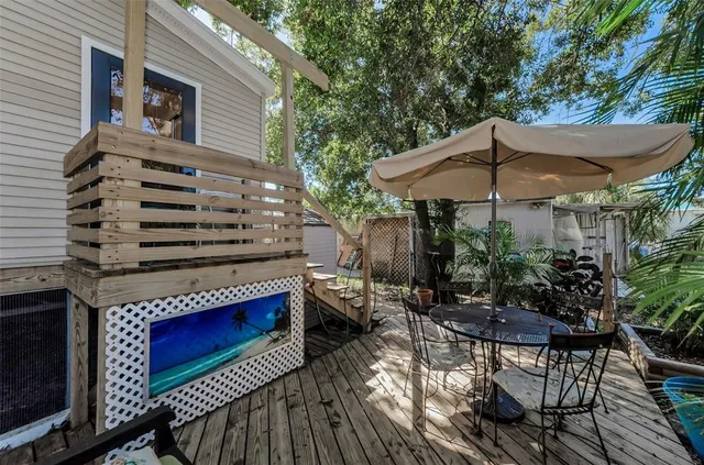 a kitchen with a wooden cabinets and outdoor space