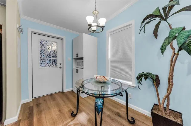 a kitchen with a stove a refrigerator and a sink