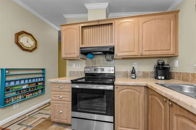 a living room with furniture and a dining table