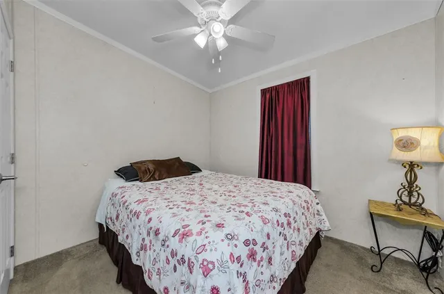 an aerial view of a house with garden space and outdoor seating