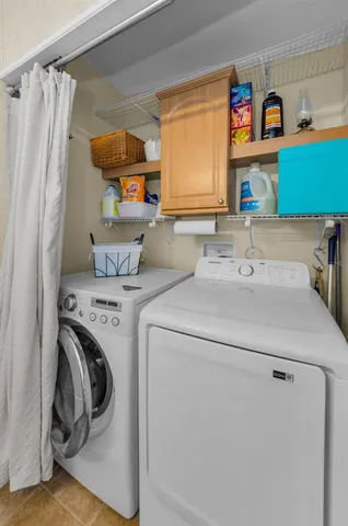 an aerial view of a house with garden space and outdoor seating
