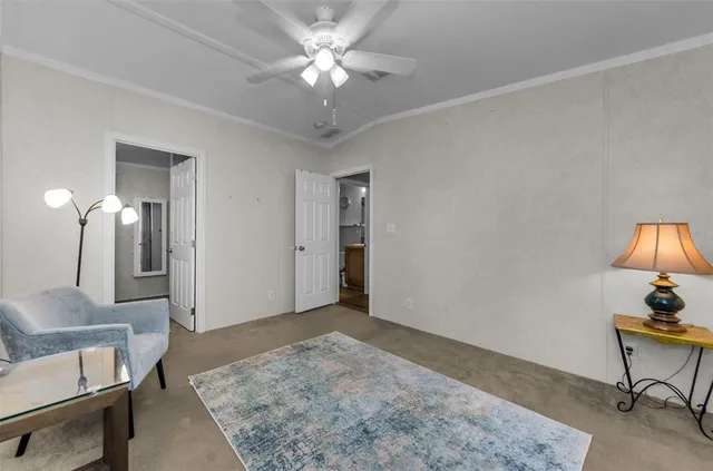 a view of a patio with table and chairs under an umbrella