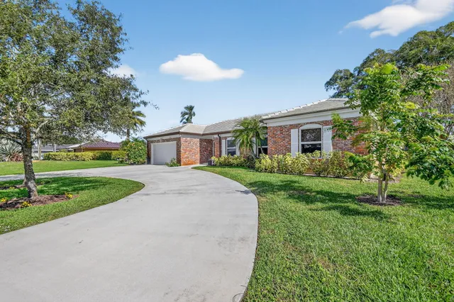 $799,900 | 224 Orange Tree Drive, Atlantis, FL 33462