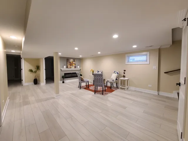 a view of a room with furniture and a wooden floor