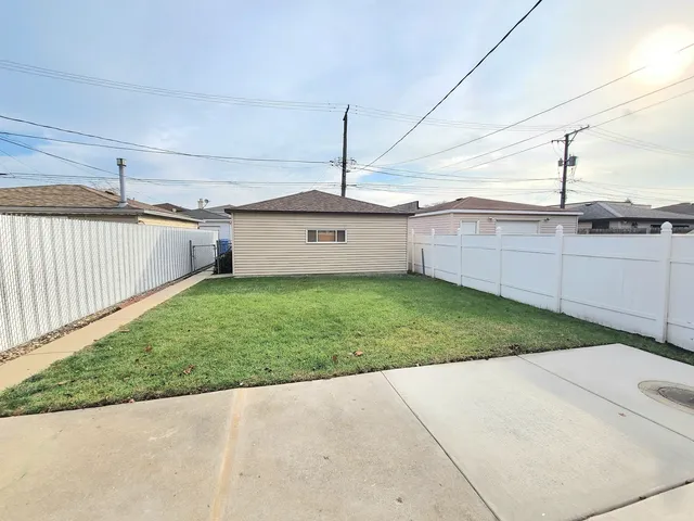 a backyard of a house with a garden