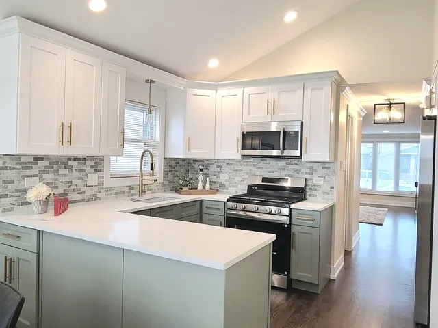 a kitchen with a sink stove top oven and cabinets
