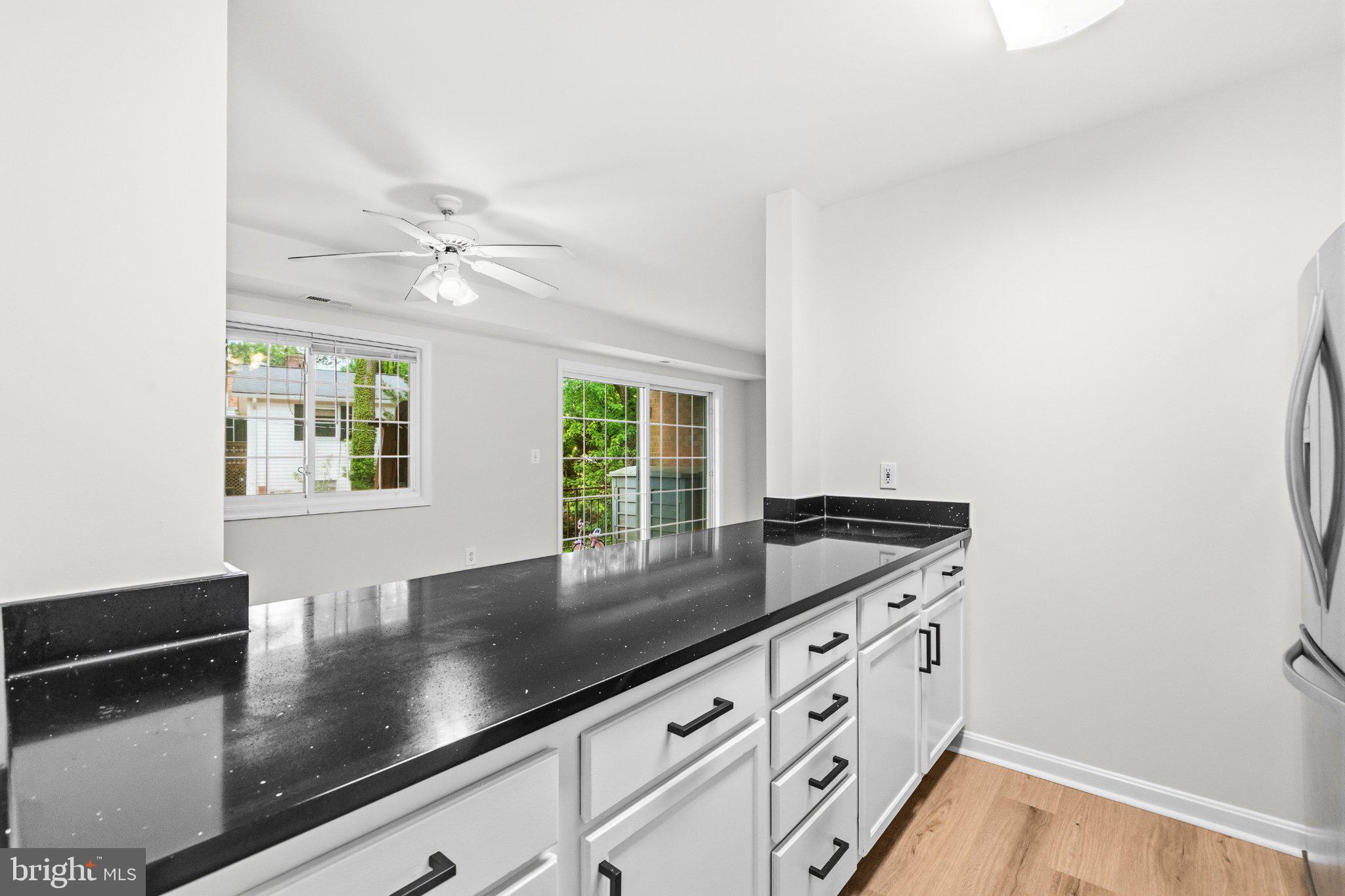 635 Waterloo Road, Unit 222 Warrenton, VA 20186 - Photo 16 of 33 a kitchen with granite countertop a sink and a window