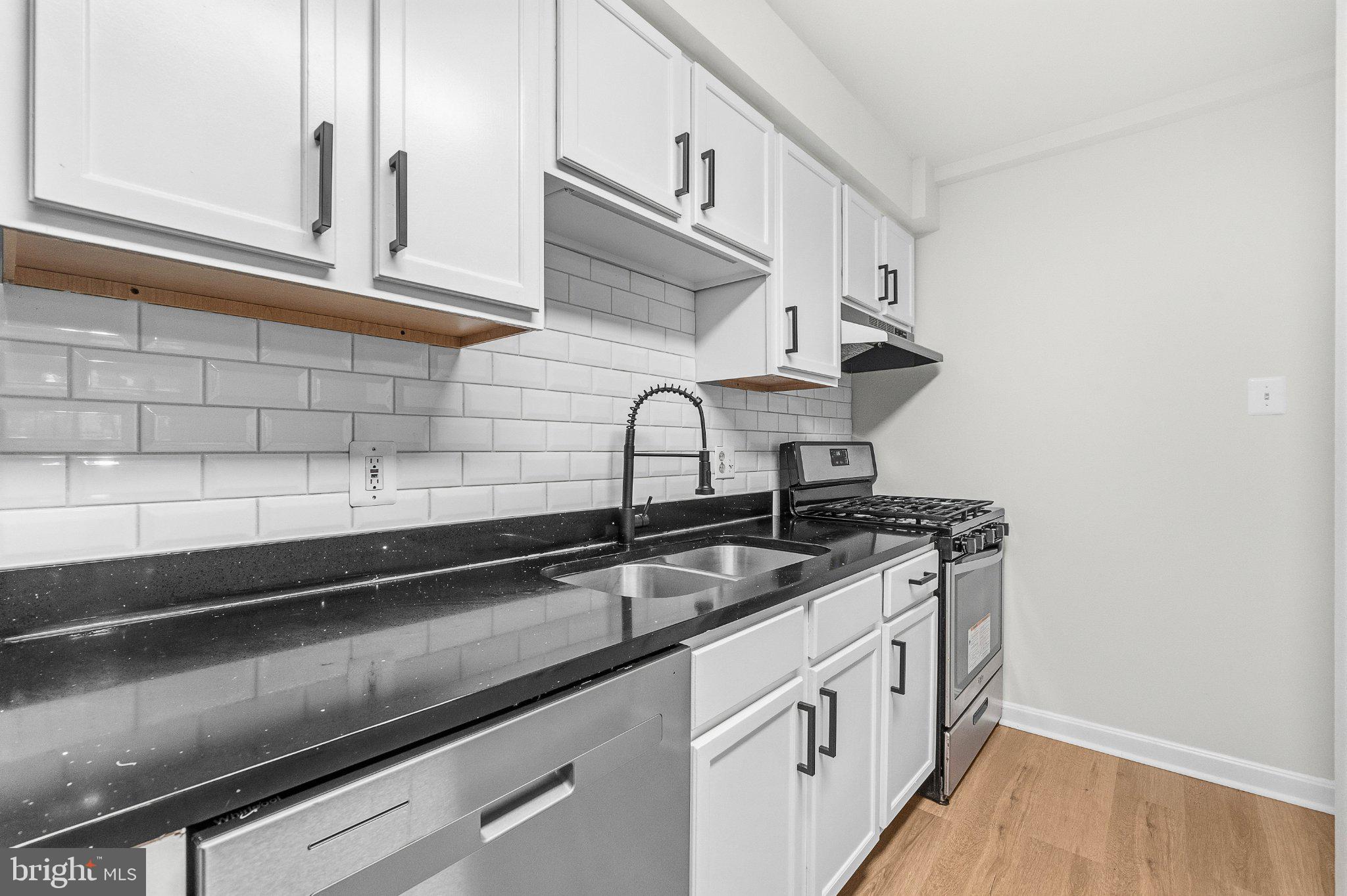 635 Waterloo Road, Unit 222 Warrenton, VA 20186 - Photo 18 of 33 a kitchen with stainless steel appliances granite countertop a sink stove and cabinets