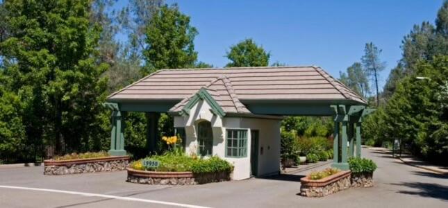 13155 Tierra Heights Road Redding, CA 96003 - Photo 3 of 9 a view of a patio with table and chairs potted plants and floor to ceiling window and tree