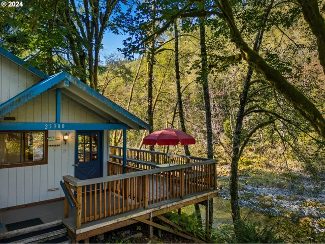 a view of a chair and table on the deck