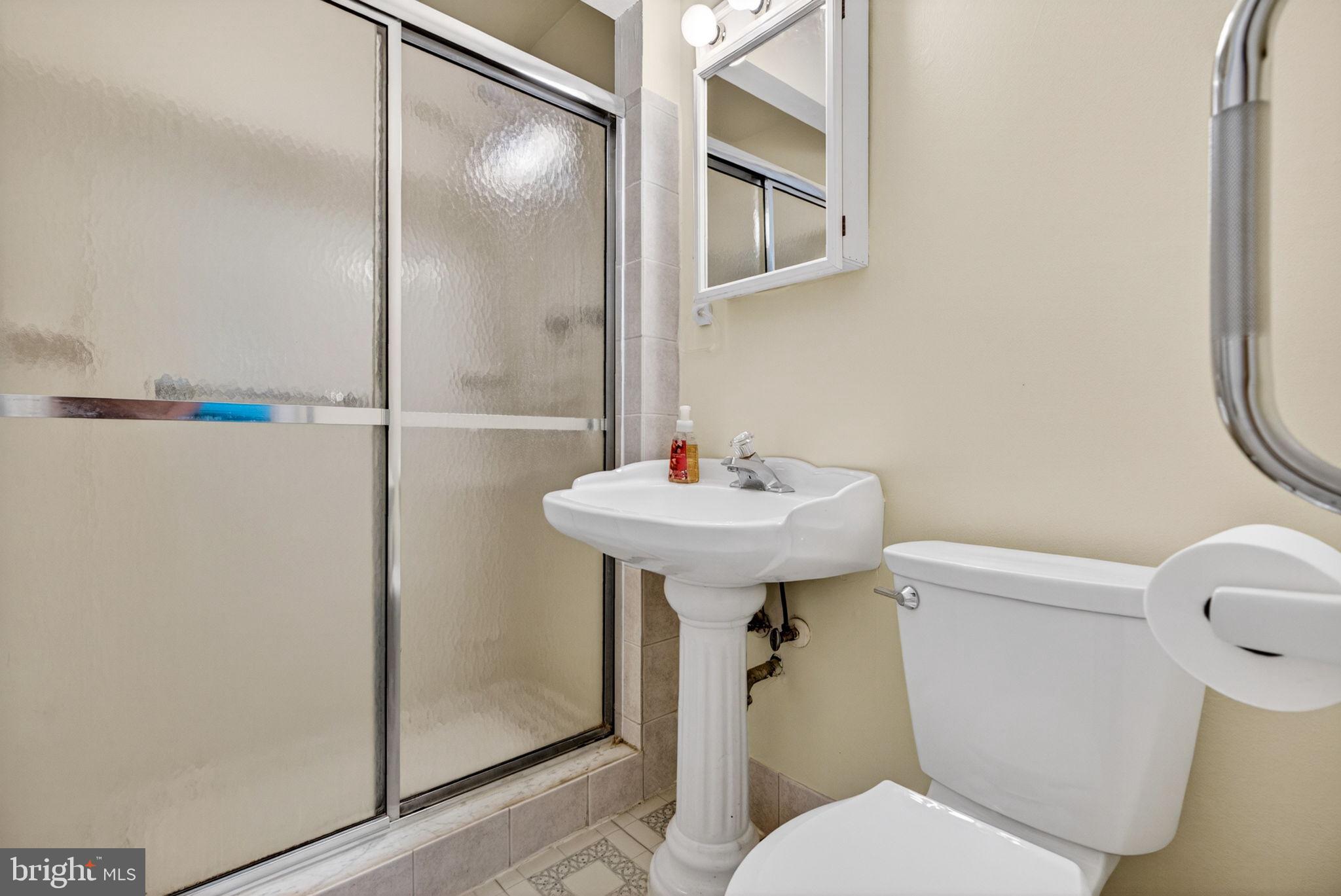 46 Trinity Avenue Marlton, NJ 08053 - Photo 17 of 37 a white toilet sitting next to a bathroom sink