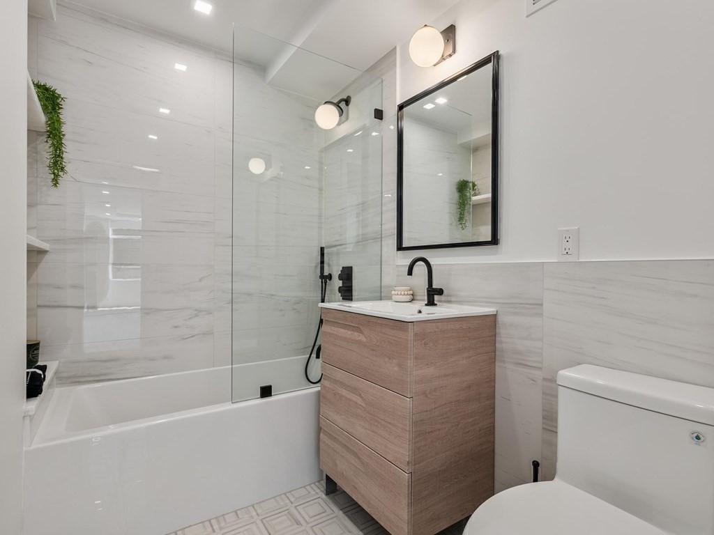 80 Park Street, Unit 24 Brookline, MA 02446 - Photo 13 of 17 a bathroom with a sink a toilet and shower