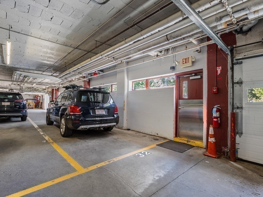 80 Park Street, Unit 24 Brookline, MA 02446 - Photo 15 of 17 a view of parking garage with cars