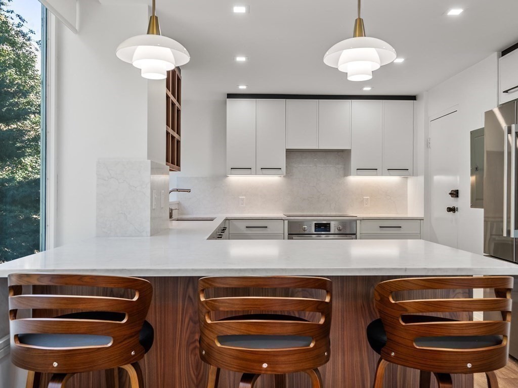 80 Park Street, Unit 24 Brookline, MA 02446 - Photo 3 of 17 a kitchen with a counter space a sink and appliances