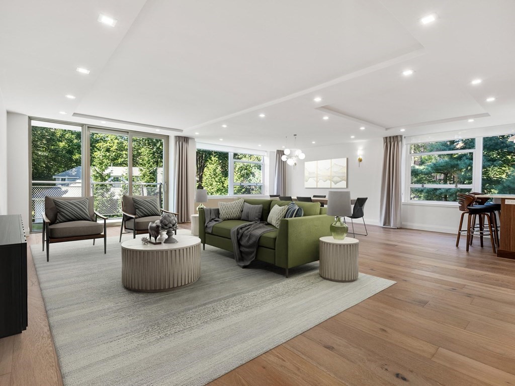 80 Park Street, Unit 24 Brookline, MA 02446 - Photo 7 of 17 a living room with furniture and a large window