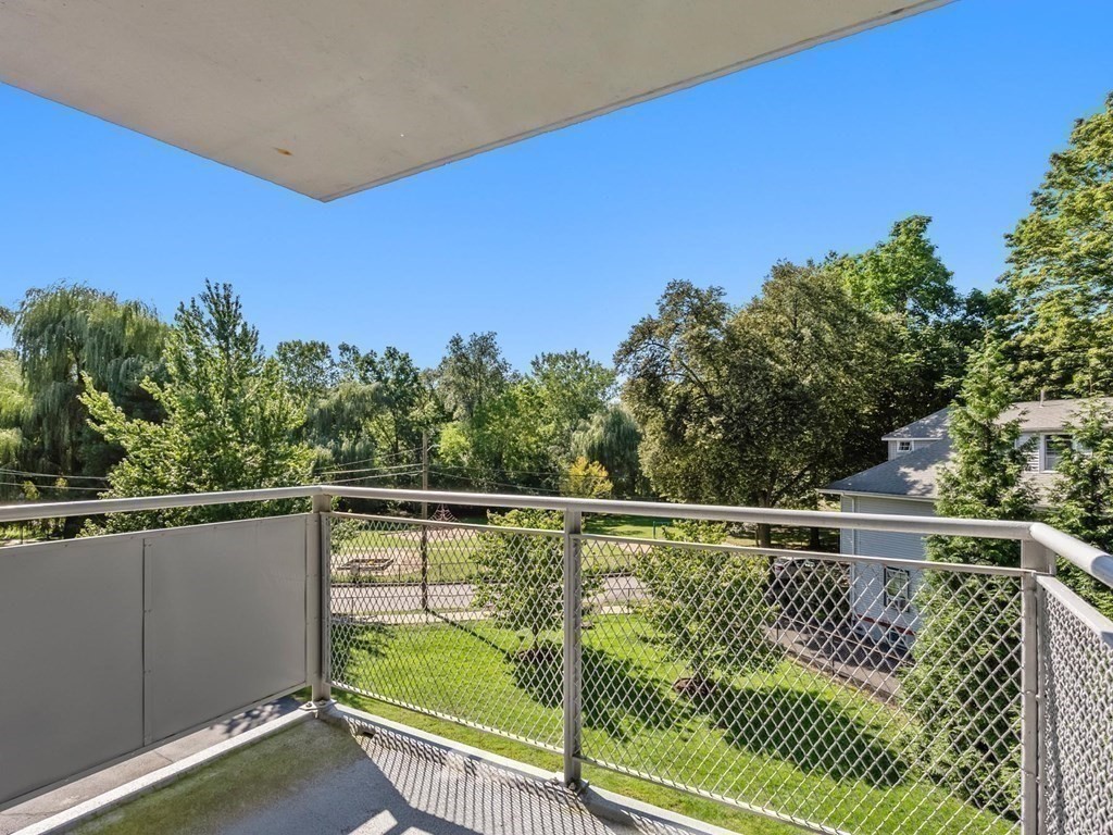 80 Park Street, Unit 24 Brookline, MA 02446 - Photo 8 of 17 a view of a balcony and yard