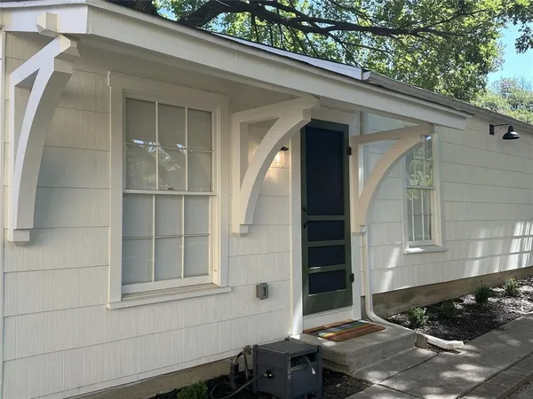 a front view of a house with a garage