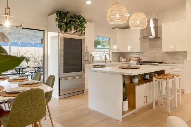 a kitchen with a sink appliances and cabinets