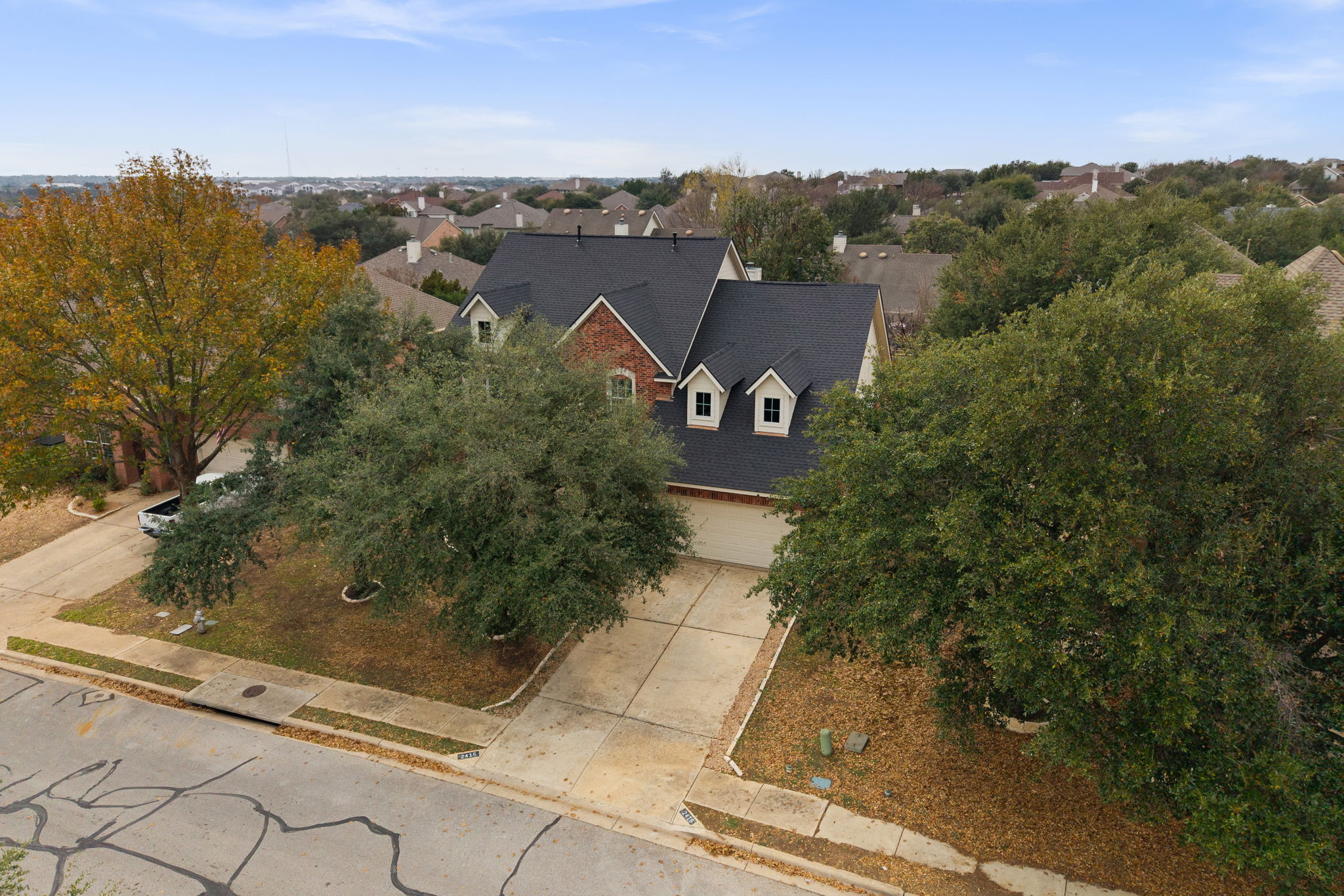 2415 Elkhorn Ranch Road Leander, TX 78641 - Photo 30 of 38 Aerial view of property and surrounding area featuring a tree filled landscape