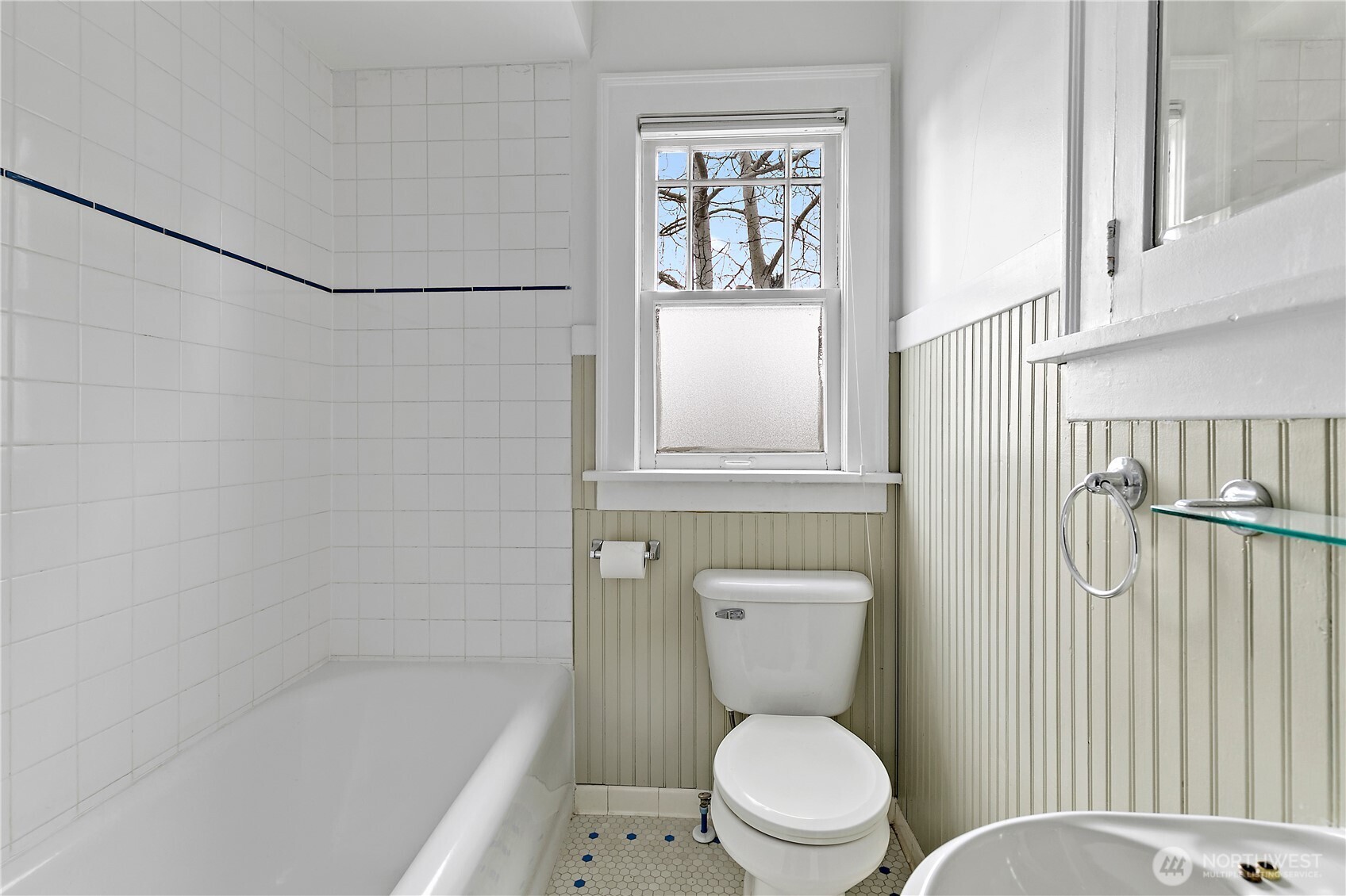 1125 North 77th Street Seattle, WA 98103 - Photo 15 of 38 a white toilet sitting next to a bath tub