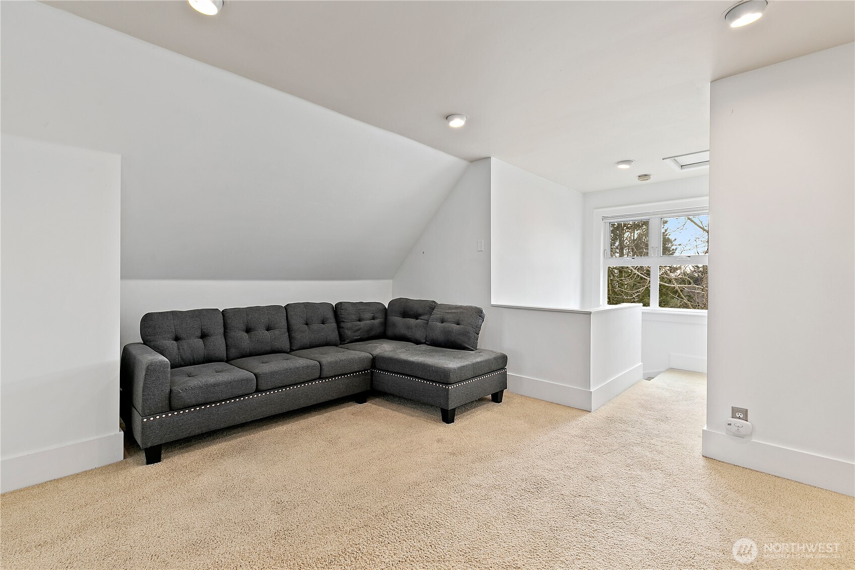 1125 North 77th Street Seattle, WA 98103 - Photo 17 of 38 a living room with furniture and a large window