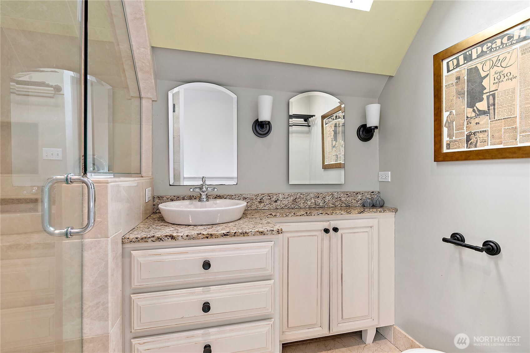 1125 North 77th Street Seattle, WA 98103 - Photo 18 of 38 a bathroom with a granite countertop sink and a mirror