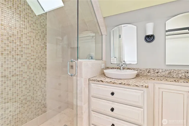 a bedroom with two beds and a window