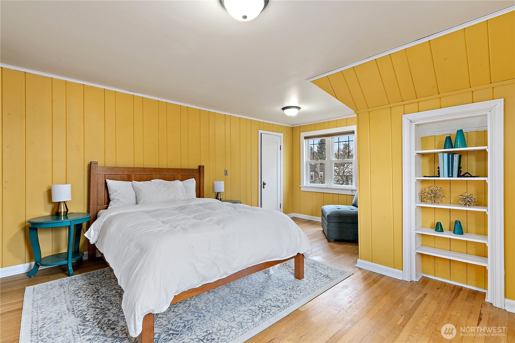 1125 North 77th Street Seattle, WA 98103 - Photo 21 of 38 a bedroom with a bed and a window