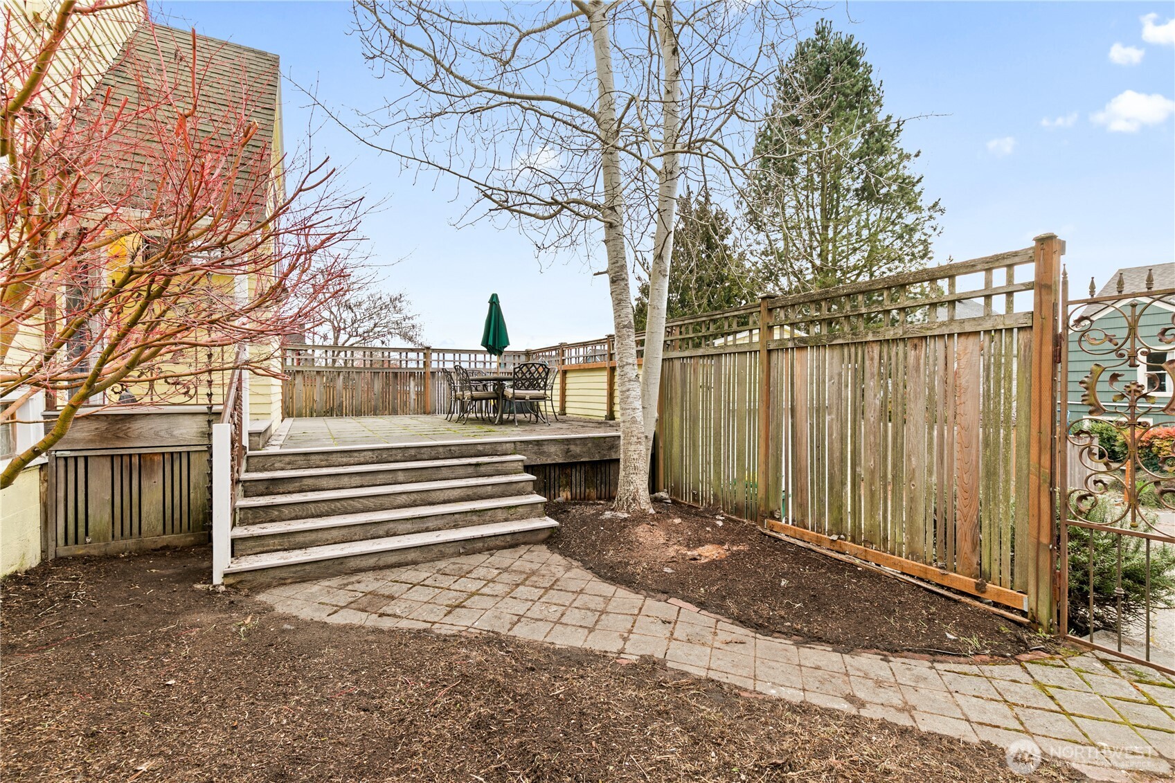 1125 North 77th Street Seattle, WA 98103 - Photo 33 of 38 a view of a backyard with a white house