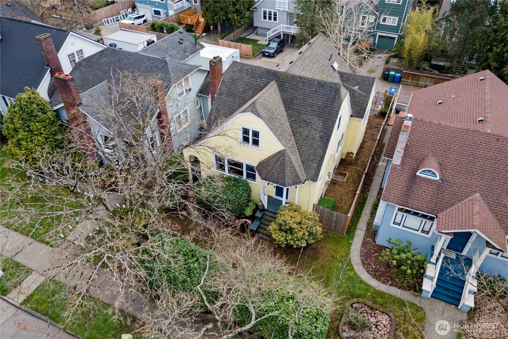 1125 North 77th Street Seattle, WA 98103 - Photo 34 of 38 an aerial view of a house with a yard and lake view