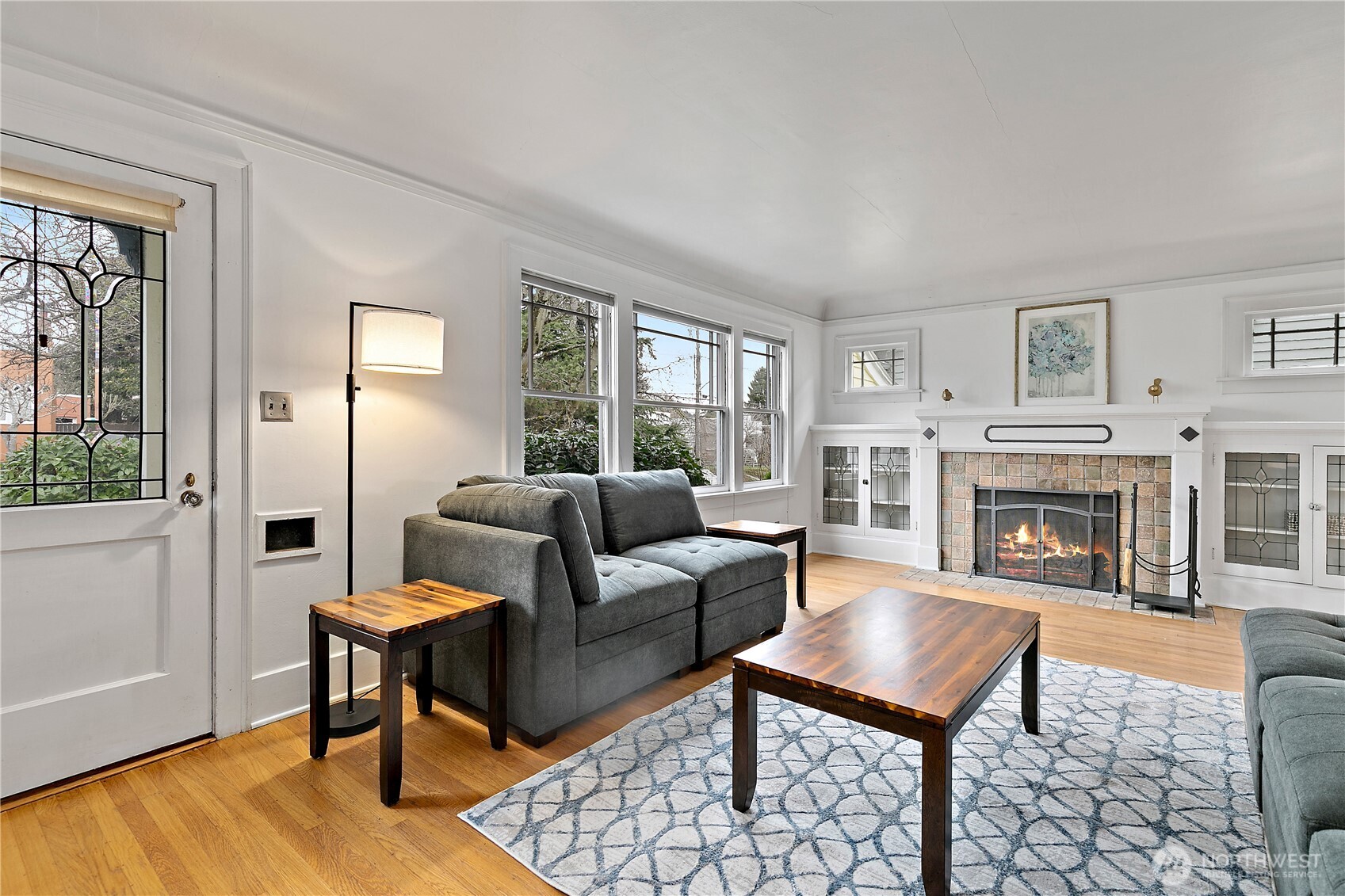1125 North 77th Street Seattle, WA 98103 - Photo 4 of 38 a living room with furniture a fireplace and a window