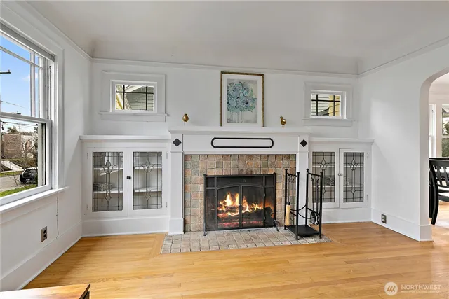 a view of a dining room with furniture wooden floor and chandelier