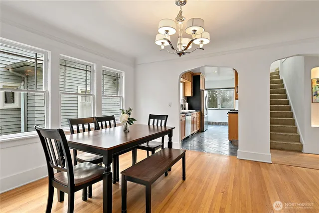 a view of a dining room with furniture window and wooden floor
