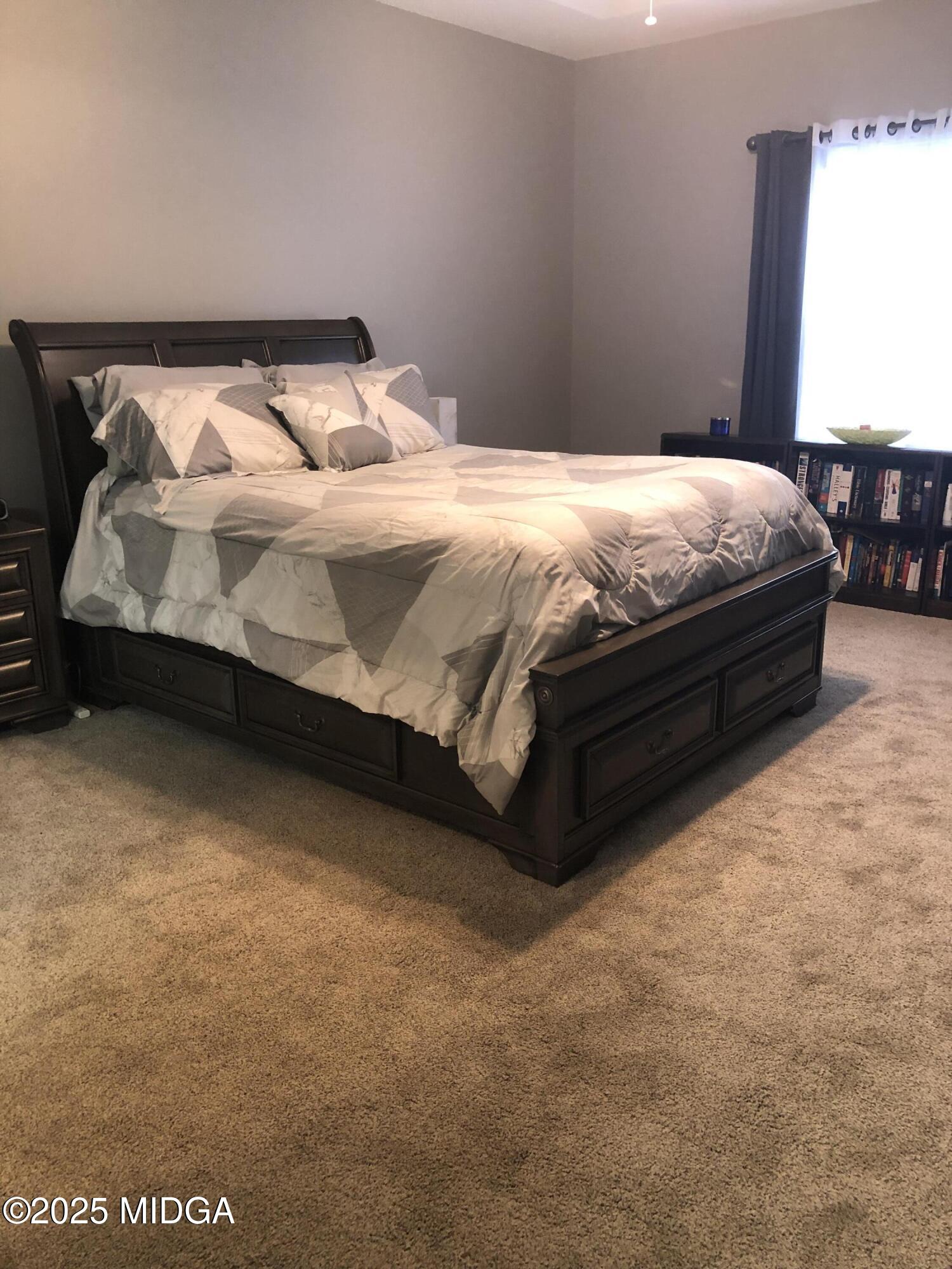 630 Millrun Court Macon, GA 31210 - Photo 12 of 23 a bedroom with a bed and window