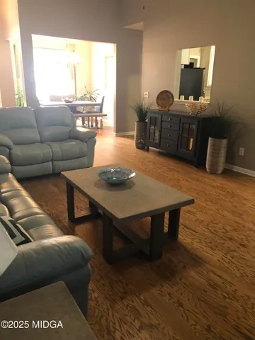 a white toilet sitting next to a bathroom sink