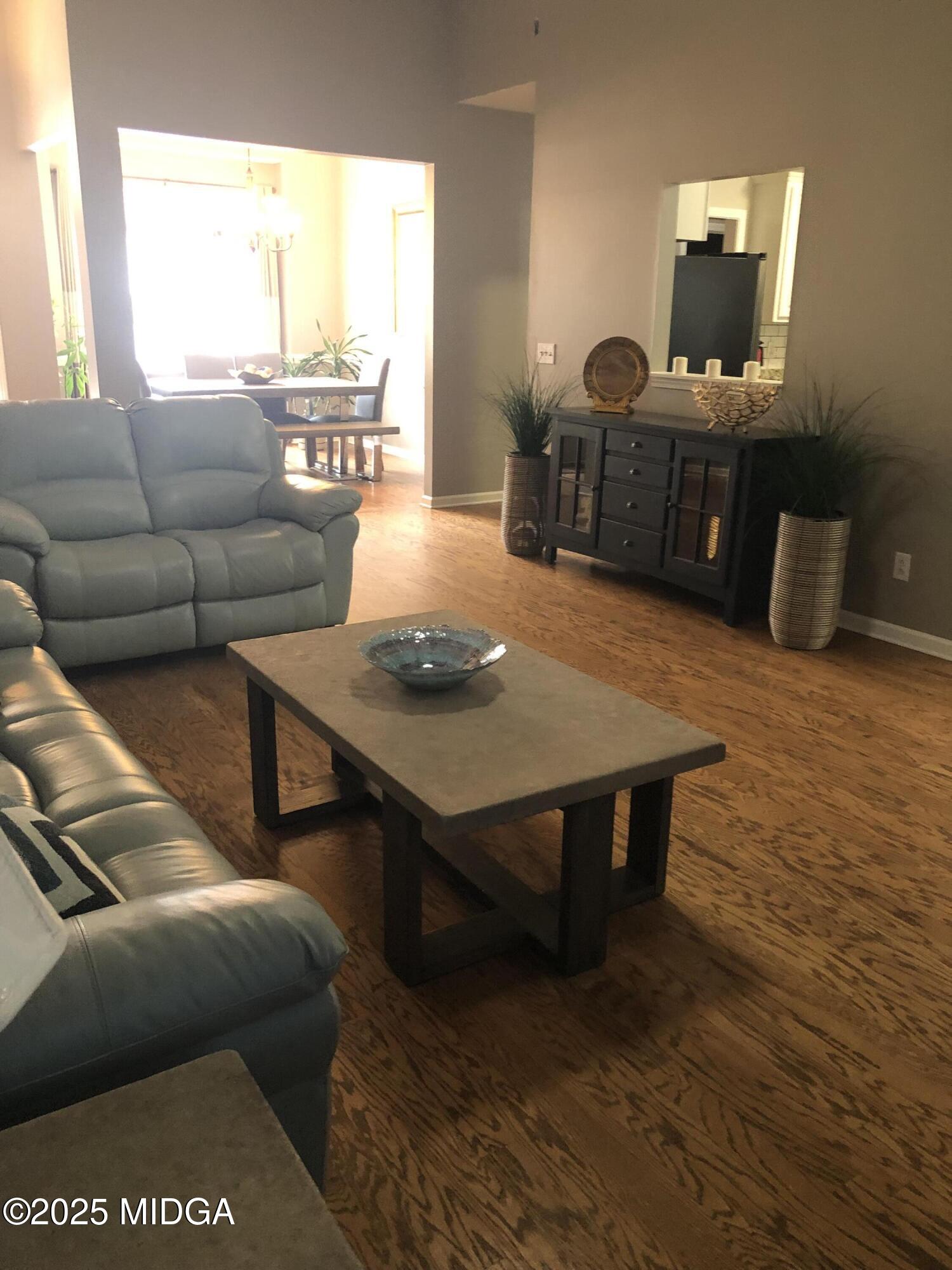 630 Millrun Court Macon, GA 31210 - Photo 15 of 23 a living room with furniture rug and window