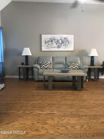 a large bed sitting in a bedroom next to a window