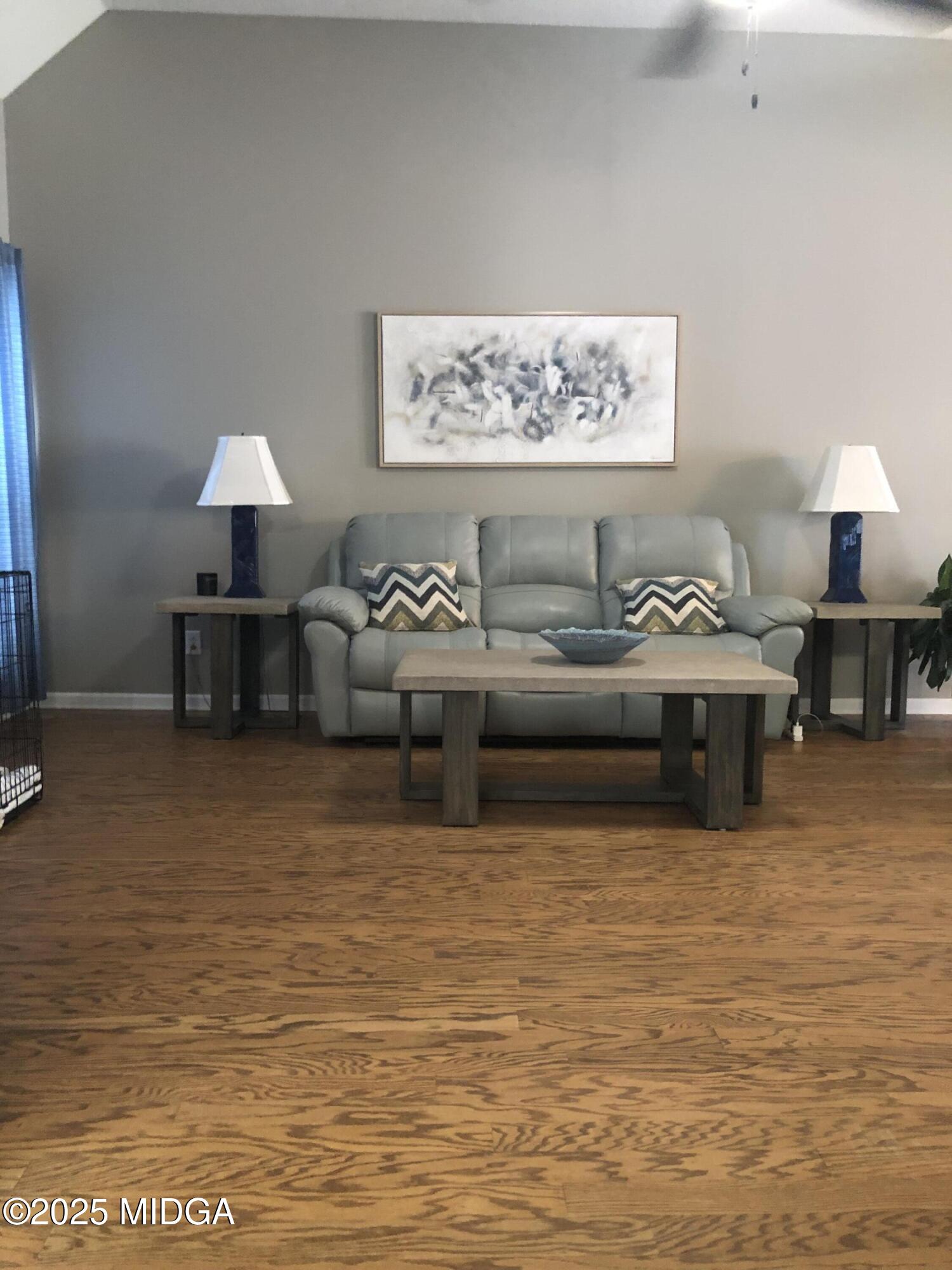 630 Millrun Court Macon, GA 31210 - Photo 18 of 23 a living room with furniture and a lamp