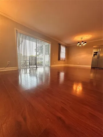 a view of a livingroom with wooden floor
