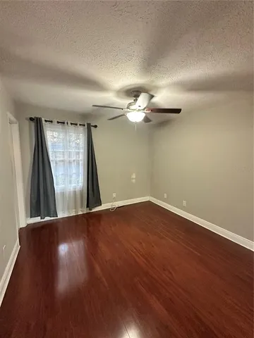 a view of a livingroom with wooden floor