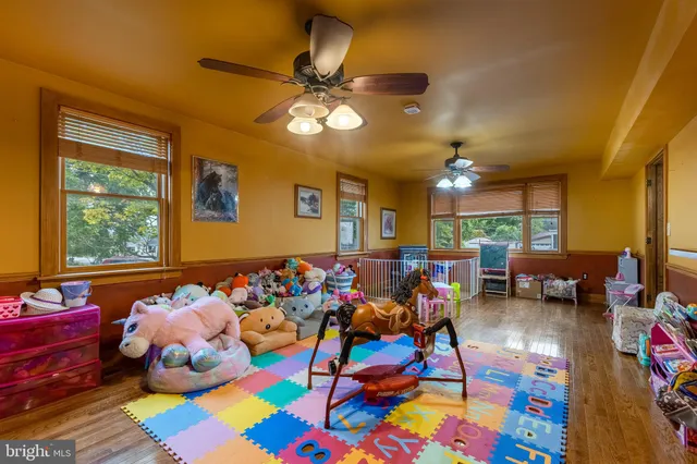 a living room filled with toys and dining area