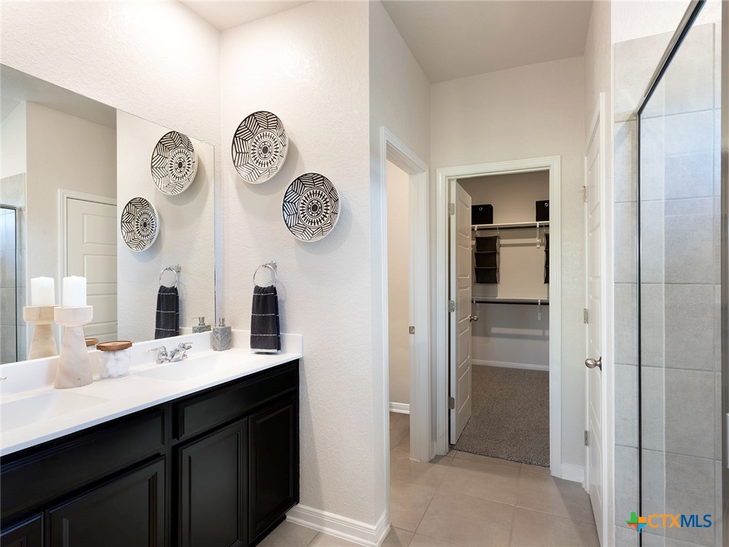 125 Dakota Ridge Cibolo, TX 78108 - Photo 8 of 13 a bathroom with a sink and a mirror