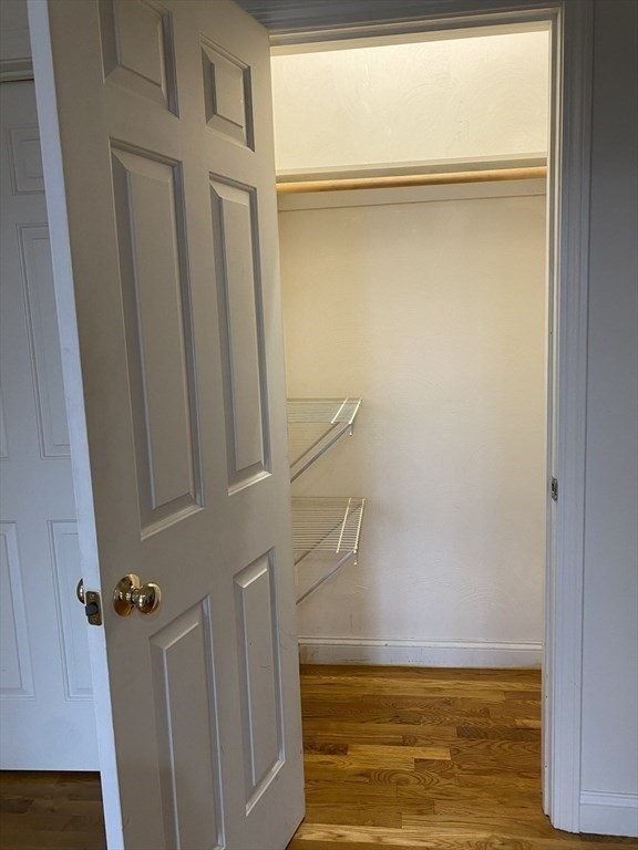 1008 Bennington Street, Unit 4A Boston, MA 02128 - Photo 8 of 9 a view of walk in closet with empty racks