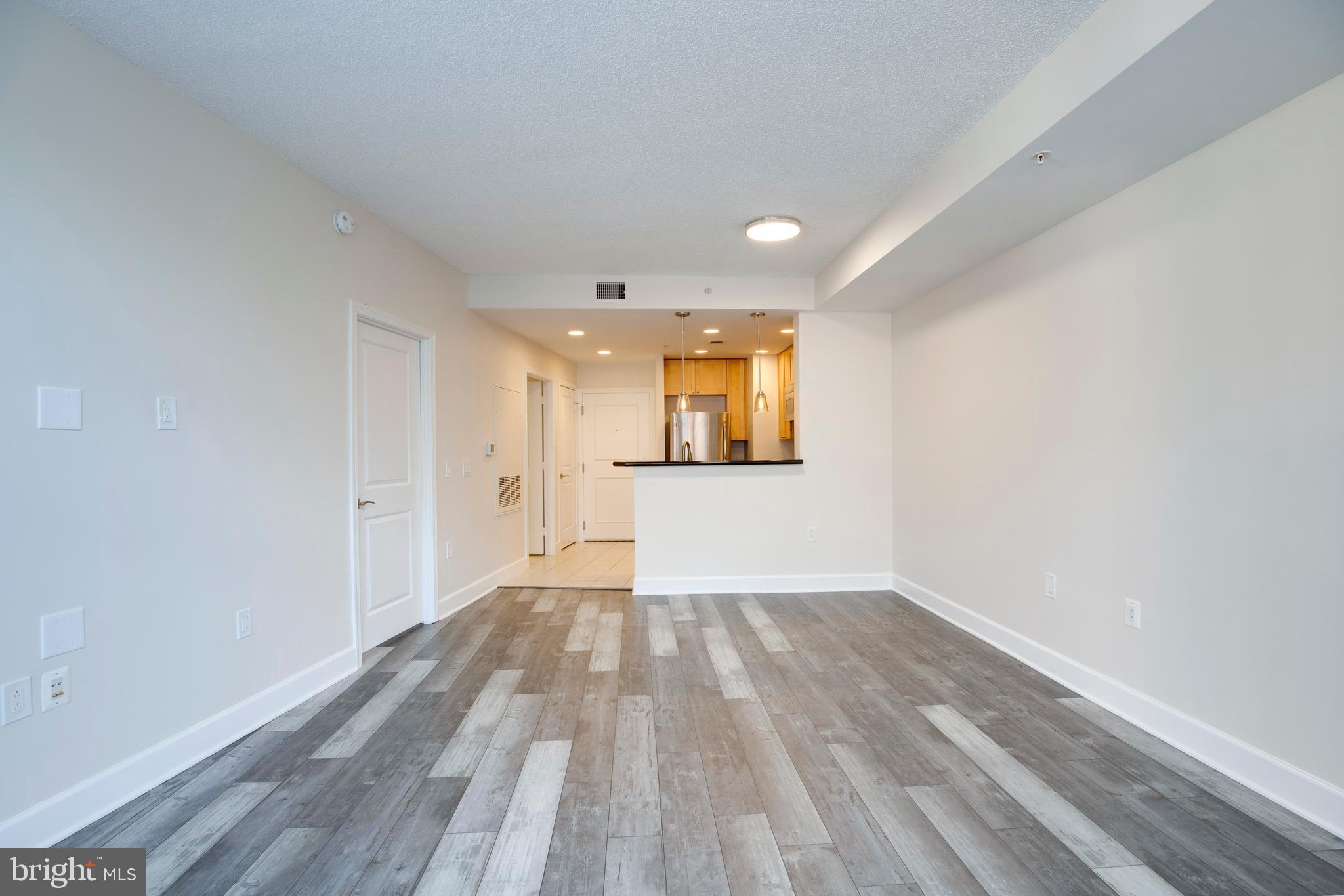 3600 South Glebe Road, Unit 427W Arlington, VA 22202 - Photo 13 of 49 a view of a room with wooden floor and a window