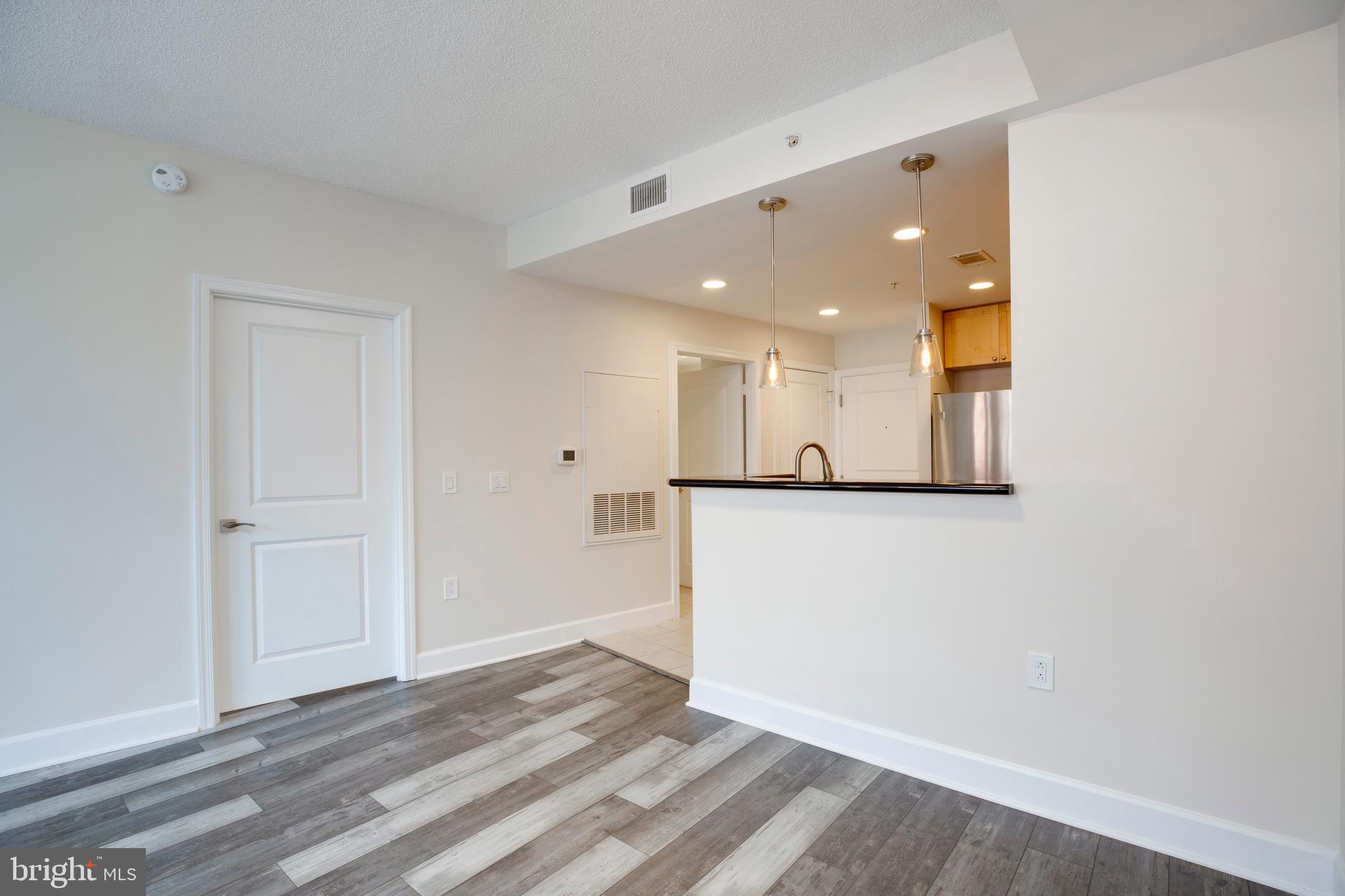 3600 South Glebe Road, Unit 427W Arlington, VA 22202 - Photo 14 of 49 a view of a hallway with wooden floor