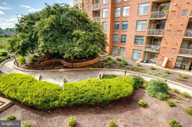 a view of hallway with wooden floor