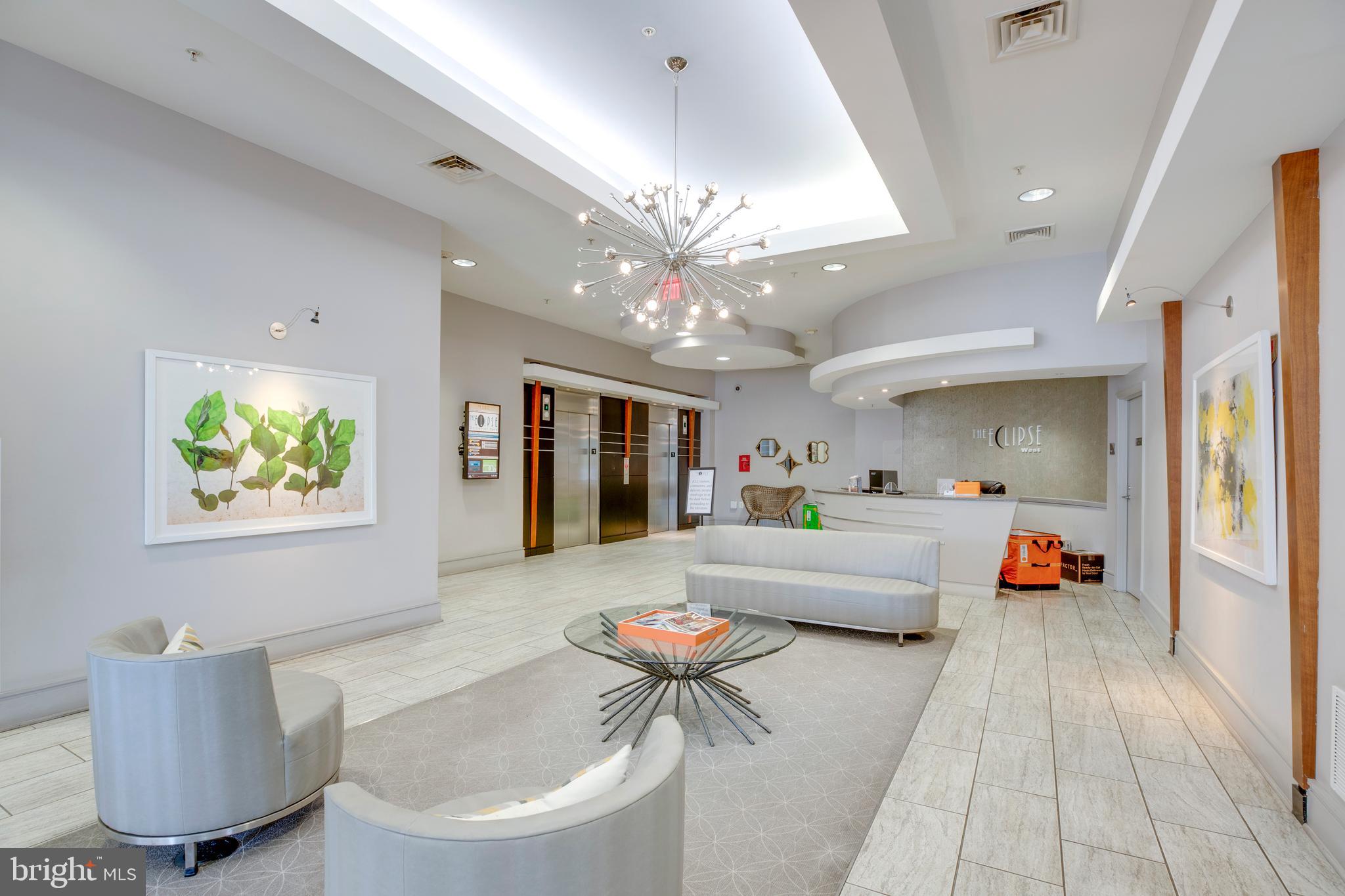 3600 South Glebe Road, Unit 427W Arlington, VA 22202 - Photo 27 of 49 a living room with furniture and a chandelier