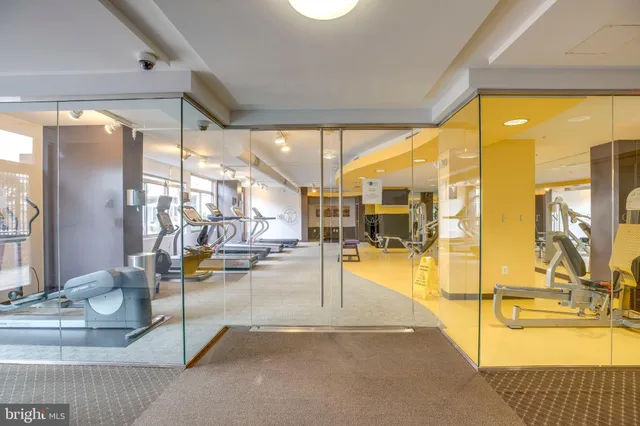 a living room with dining table and chairs
