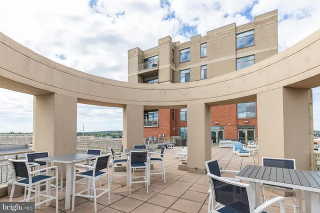 a view of a balcony with wooden floor