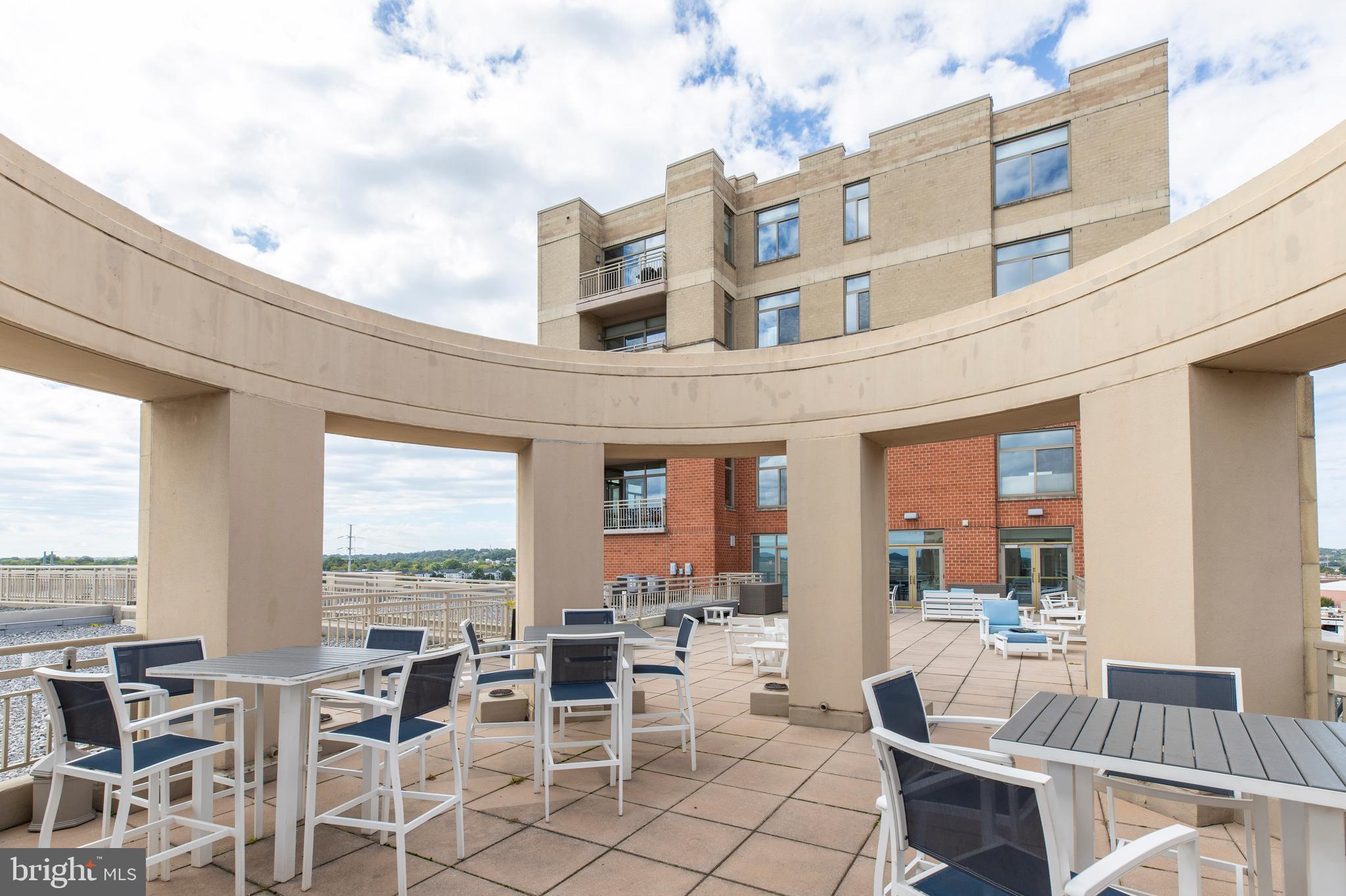3600 South Glebe Road, Unit 427W Arlington, VA 22202 - Photo 44 of 49 a view of a patio with dining table and chairs